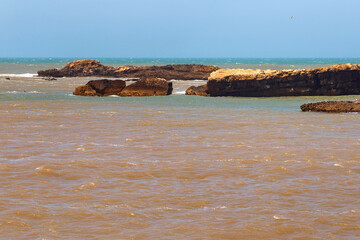 Volcanic coast of the Atlantic ocean in the Essaouira on a sunny summer day. Morocco.
