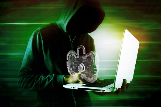 the hacker in the hood breaks the lock