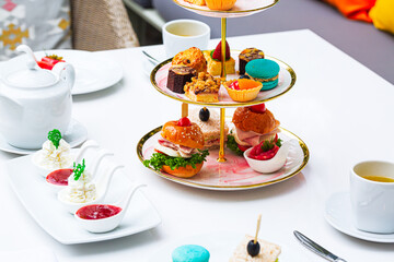 Tea and sweets,Traditional english afternoon tea with selection of cakes and sandwiches 