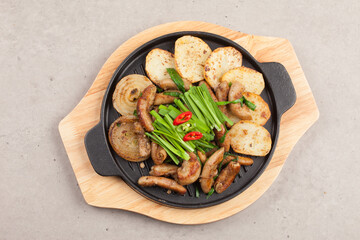 Finely chopped small intestine seasoned and grilled.