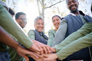 Teamwork, motivation and huddle with senior friends hiking together in the forest or woods from below. Fitness, exercise or nature with a mature man and woman friend group putting hands in a circle - Powered by Adobe