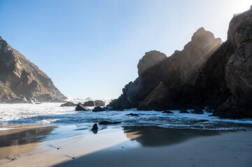 Fototapeta na wymiar Late afternoon impression of Pfeiffer beach, California on a bright sunny afternoon as the sun is about to set.