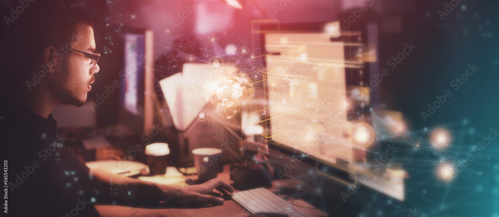 Aufkleber Digital, hologram and night with a designer man at work in a dark office for overtime on a cybersecurity project. Overlay, software or innovation with a male programmer or developer working on design