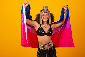Beautiful black Brazilian woman, in Cleopatra carnival clothes, holding bisexual flag.