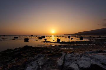 Obraz na płótnie Canvas 鵜ノ崎海岸から望む夕陽
