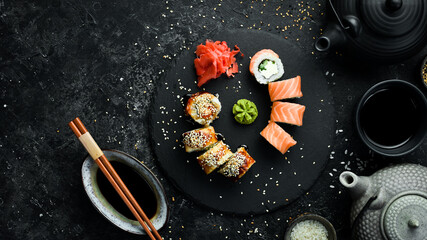 Sushi rolls on a stone plate. Close-up. Japanese food.