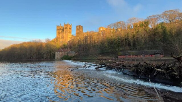 Steady footage of the River Wear and the Cathedral of Durham (UK) at sunset