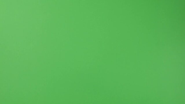 Falling Canadian 100 dollar polymer banknotes with a portrait of Robert Borden on a green background. Slow motion.