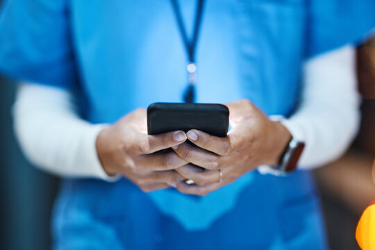 Phone, hands and medical nurse in hospital working on telehealth, research or online consultation. Healthcare smartphone, woman and female physician with mobile for wellness app in clinic at night. - Powered by Adobe