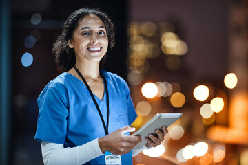 Tablet, city and portrait of a woman doctor doing research at night on rooftop of hospital building. Medical, lights and female healthcare worker working late on mobile device on balcony of clinic.