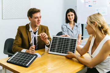 Business person meeting on solar cell panel technology. Business People Discussing Solar Power...