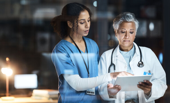 Doctors, nurse and digital tablet for night teamwork, medical research and surgery planning in wellness hospital. Talking, healthcare and worker women in collaboration on technology for late thinking