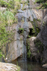 Fototapeta na wymiar William Wright waterfalls in a sunny day, Waihi, New Zealand