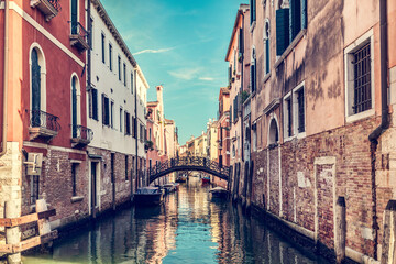Fototapeta na wymiar Canal with bridge in Venice, Italy.