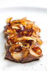 steak covered by caramelized onion
