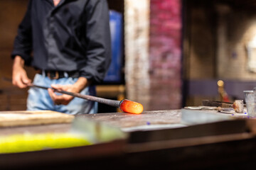 Glass blower at work in workshop in Murano, Italy