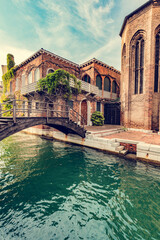 Naklejka premium Canal with old bridge in Venice, Italy.