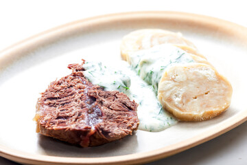 beef meat with dill sauce and dumplings