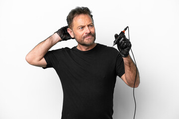 Tattoo artist middle age man isolated on white background having doubts