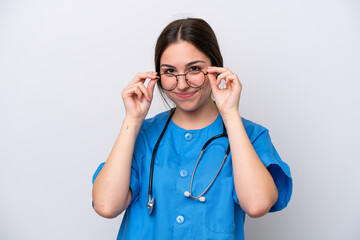 surgeon doctor woman holding tools isolated on white background with glasses and surprised