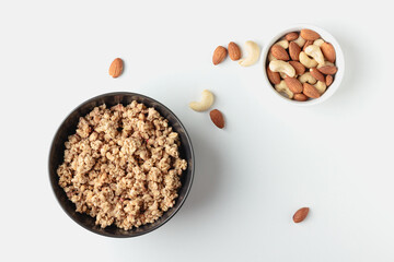 Granola in bowl on light background.