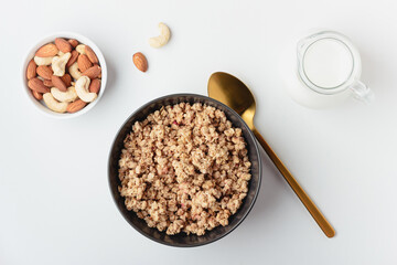 Granola in bowl on light background.
