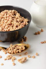 Granola in bowl on light background.