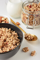 Granola in bowl on light background.