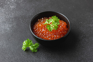 Red caviar with parsley in bowl