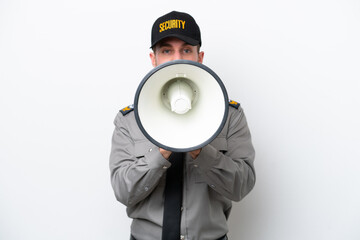 Young safeguard caucasian man isolated on white background shouting through a megaphone