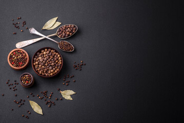 Spice allspice brown color not ground in a wooden saucer. Asian food