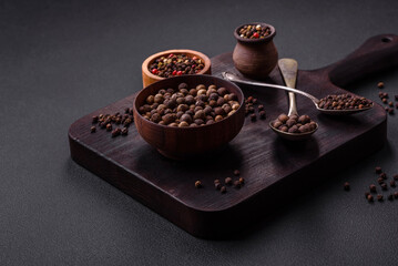 Spice allspice brown color not ground in a wooden saucer. Asian food