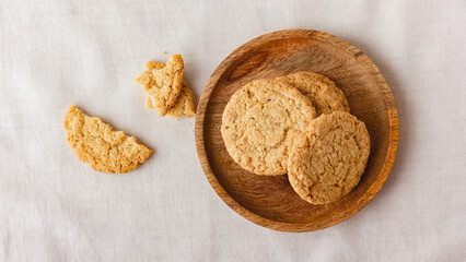Oatmeal cookies on a wooden plate