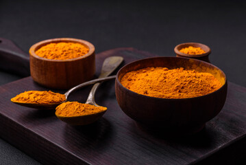 Bright yellow turmeric or curry spice for Asian food preparation