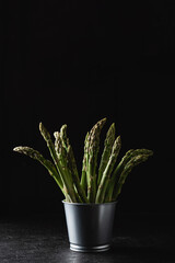 Green asparagus with copy space on a black background