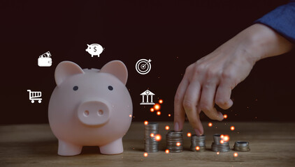 Person Hand holding piggy bank on wood table, saving money wealth and financial concept, Business, finance, investment, Financial planning for retirement. Money growth in success. security money box.