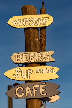Copenhagen, Denmark A sign on the Amager Strand beach pints to activities like windsurfing, beers, SUP rental and cafe.