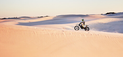 Desert, nature and athlete riding a motorcycle for exercise, fitness or skill training in nature....