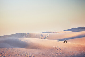 Sand landscape, motorbike or man on moto cross in desert space for sport workout, sunset ride or...