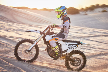 Motorcycle, athlete and sports outdoor with speed, fitness and riding in desert with extreme sport,...