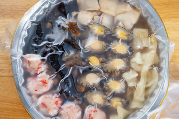 top view wrapped big bowl feast or poon choi with different seafood