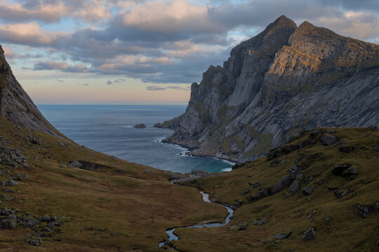 Small stream flowing through Trolldalen valley above Bunes beach