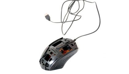 black out of order disassemled computer mouse on white background