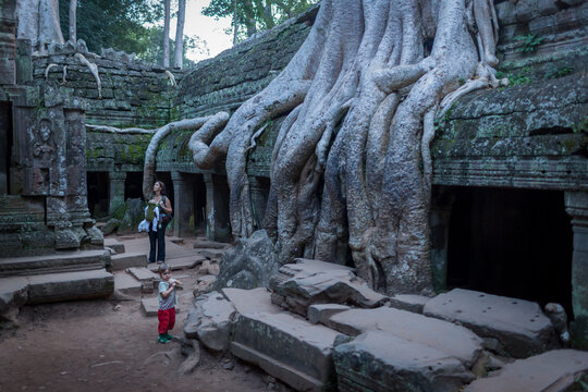 Mother travelling with children visiting Angkor Wat.