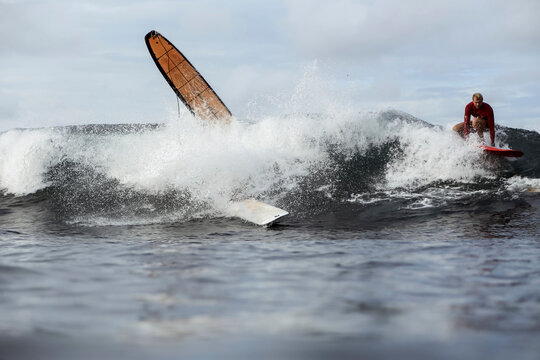 Surfers on a wave