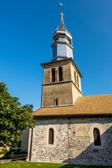 Fototapeta premium Clocher de l'église d'Yvoire, village médiéval sur le Lac Léman, l'un des plus beaux villages de France , Haute Savoie, Auvergne-Rhone-Alpes, France