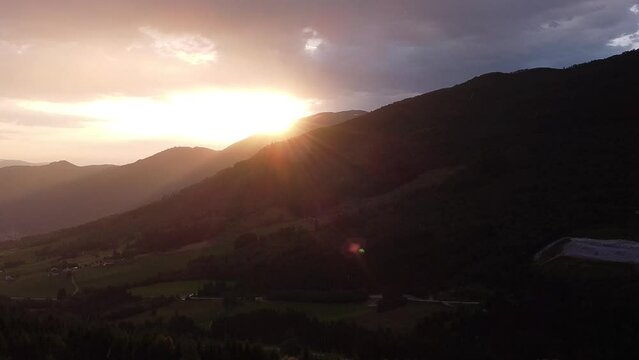 Drone view over beautiful norwegian landscape in Vik i Sogn / Vik&oslash;yri with sunbeams over mountains an early summer morning