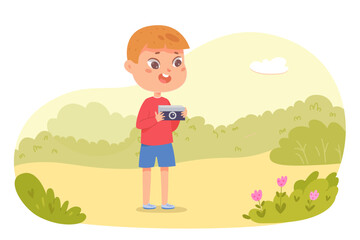 Obraz na płótnie Canvas Boy holding digital camera to take photo of nature vector illustration. Cartoon excited cute child journalist taking pictures of nature and people or news, portrait of young small photographer