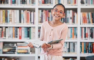 Girl, library book and portrait of a school student ready for learning, reading and studying....