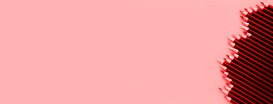 Colored pencils on  red background. Drawing concept. Banner. Copy space.	